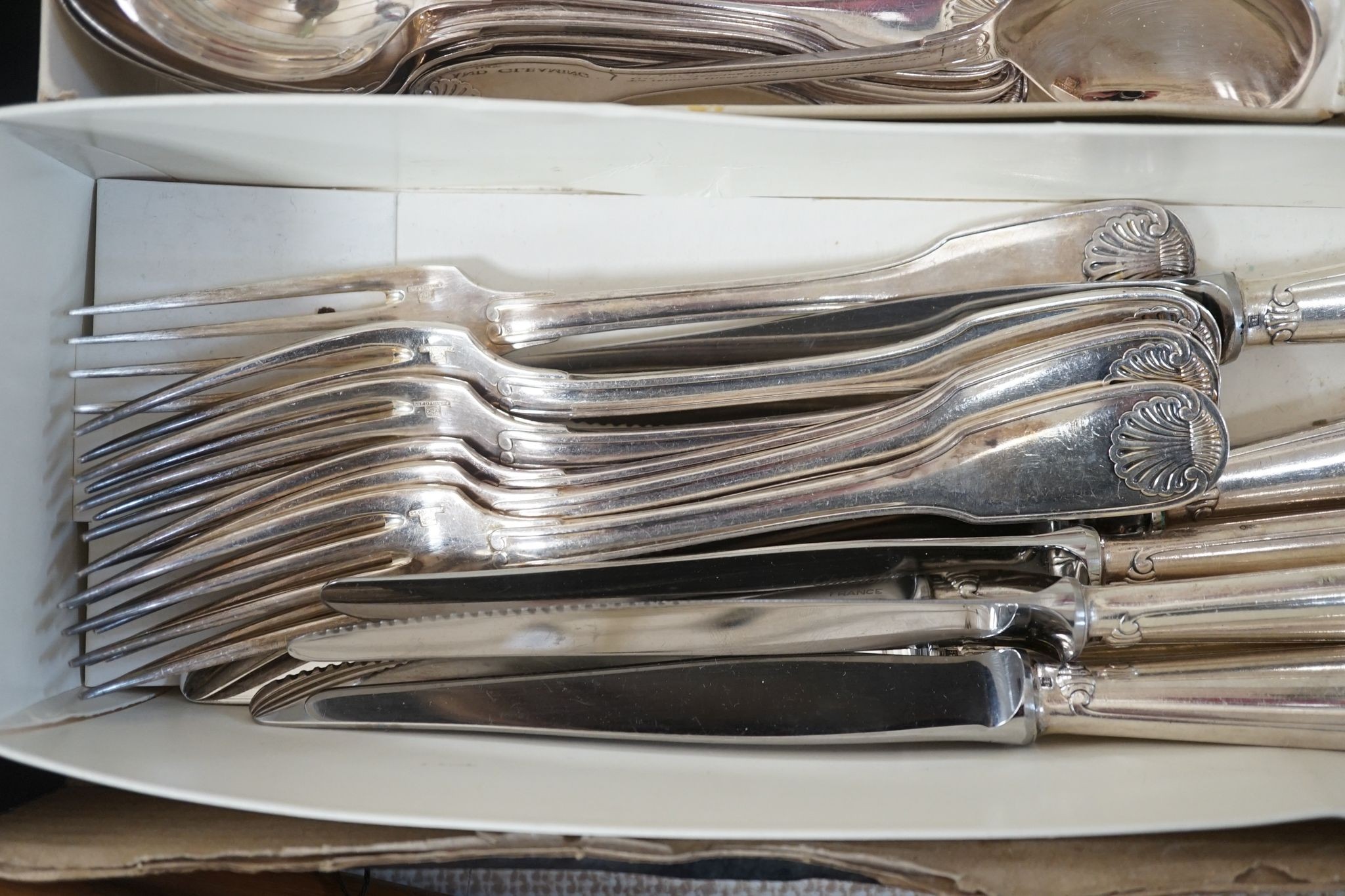 A Chistofle plated canteen of fiddle and shell pattern cutlery